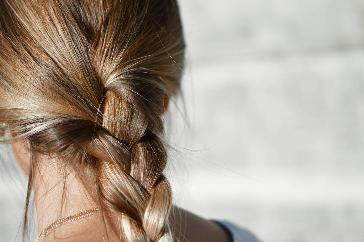 close-up of ombre hair styling showing natural-looking gradient and healthy shine