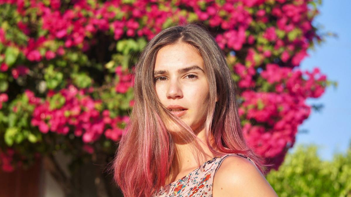 Professional salon ombre treatment showing seamless blend from dark roots to golden ends